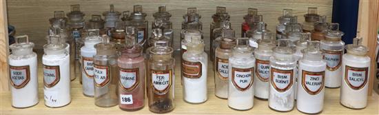 A collection of forty four late Victorian chemists dry drug jars and stoppers, with gilt framed named labels, height 17cm